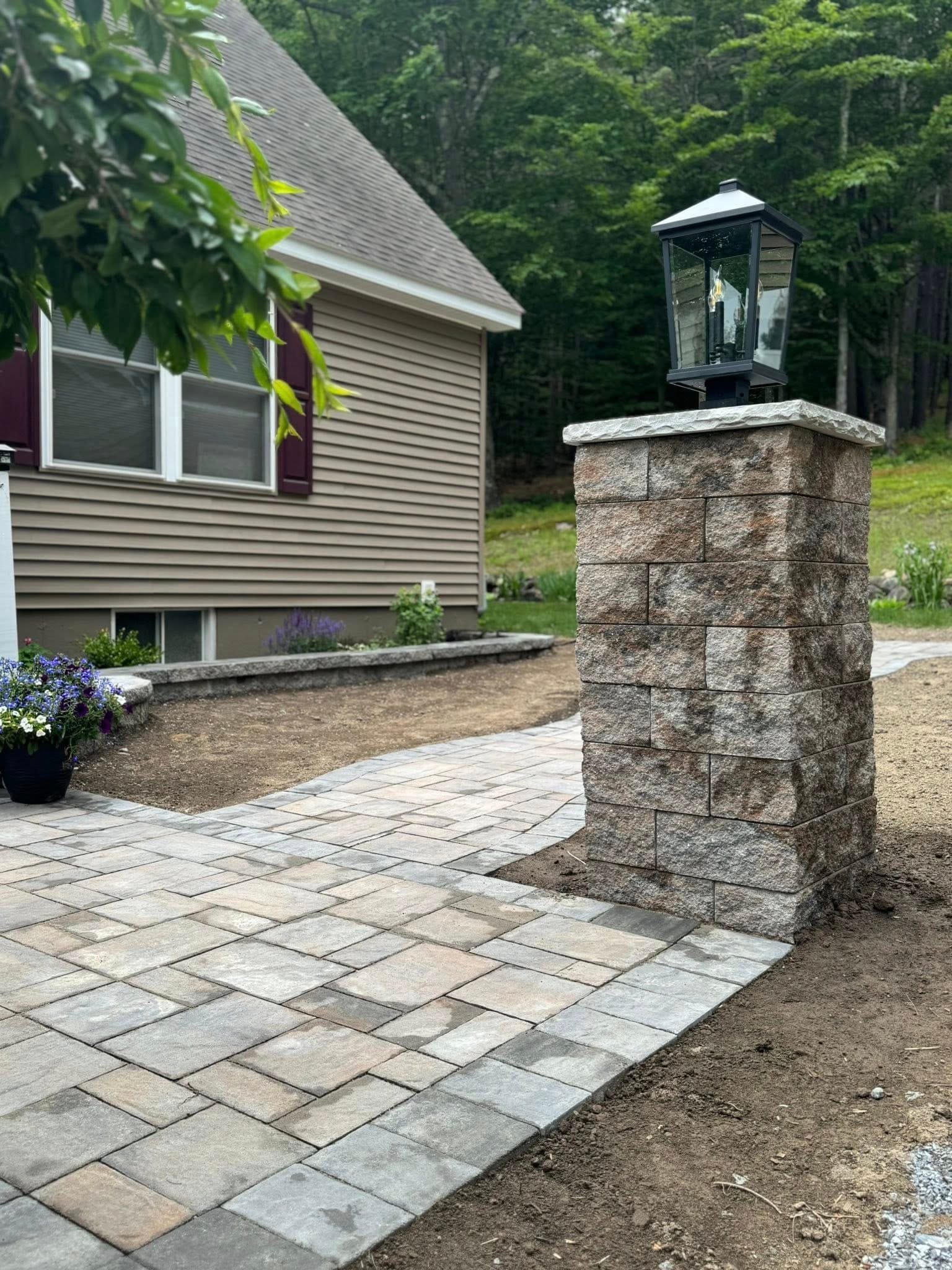 Past Projects 2 paver walkway, stone pillar, outdoor lighting, front yard path, patio walkway, hardscape design, curb appeal, landscaping ideas, garden path, exterior design, modern walkway, landscape lighting, paver installation, home entryway