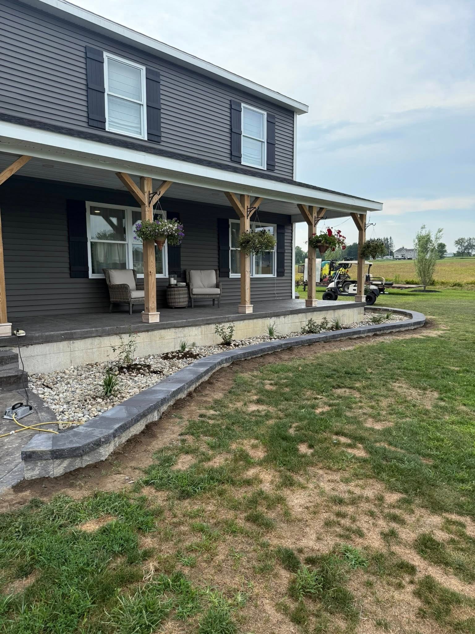 Past Projects 4 retaining wall, stone retaining wall, landscape wall, garden wall, backyard landscaping, hardscape design, slope stabilization, outdoor design, retaining wall ideas, concrete blocks, modern retaining wall
