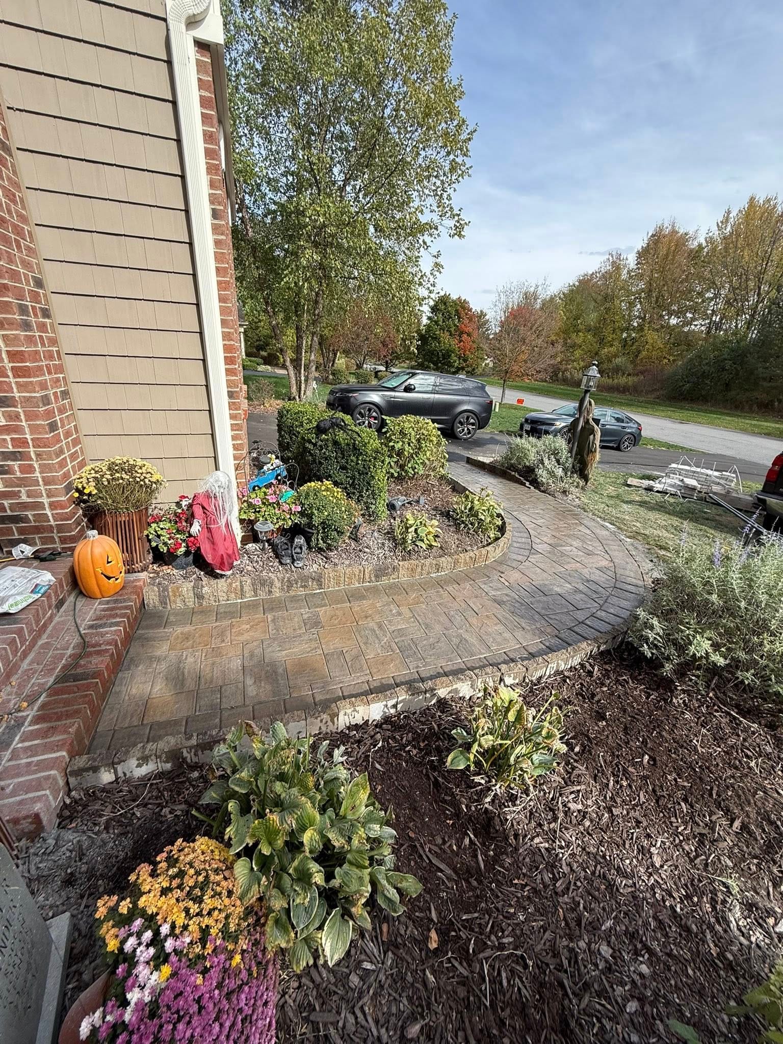 Past Projects 5 stamped concrete walkway, front walkway, brick entryway, landscape design, curb appeal, paver path, garden border, hardscape design, concrete patio, home landscaping, front yard design, outdoor walkway, decorative concrete, stone edging, residential landscaping